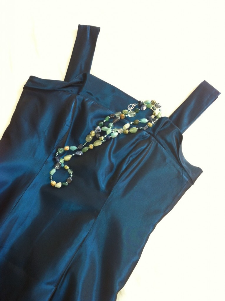 Formal dress with necklace laid over it