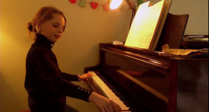 Holly playing her piano