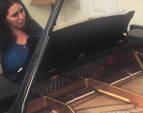 Simone Dinnerstein playing at her piano