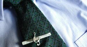 Treble_clef_tie_clip on green tie