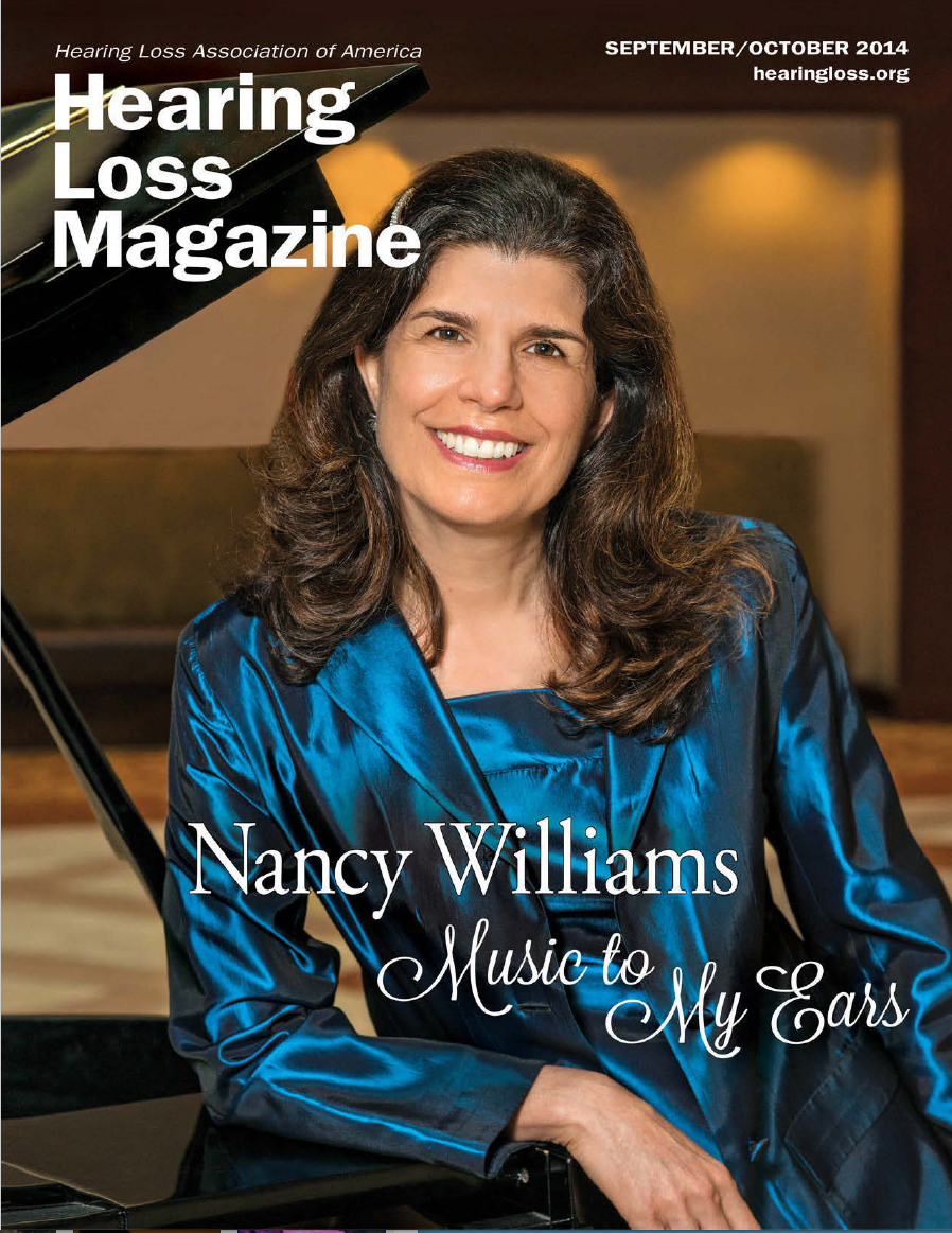 Nancy M. Williams on the cover of Hearing Loss Magazine wearing a sapphire-blue dress, leaning against a grand piano