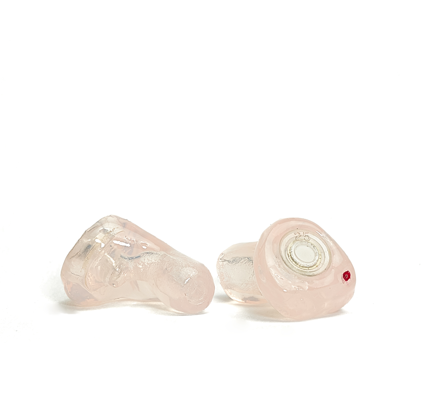 A pair of ER SERIES MUSICIAN EARPLUGS - CUSTOM from Sensaphonics, in translucent, with a pinkish color